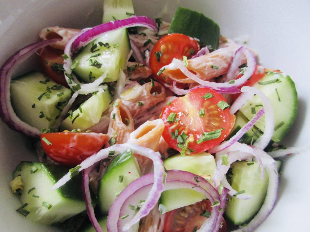 close up of gluten free side salad in white bowl.