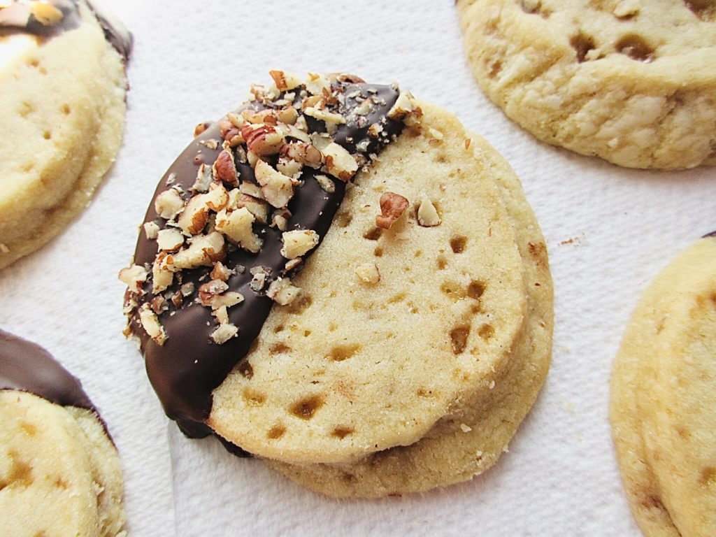 Toffee shortbread dipped in chocolate with pecan nuts