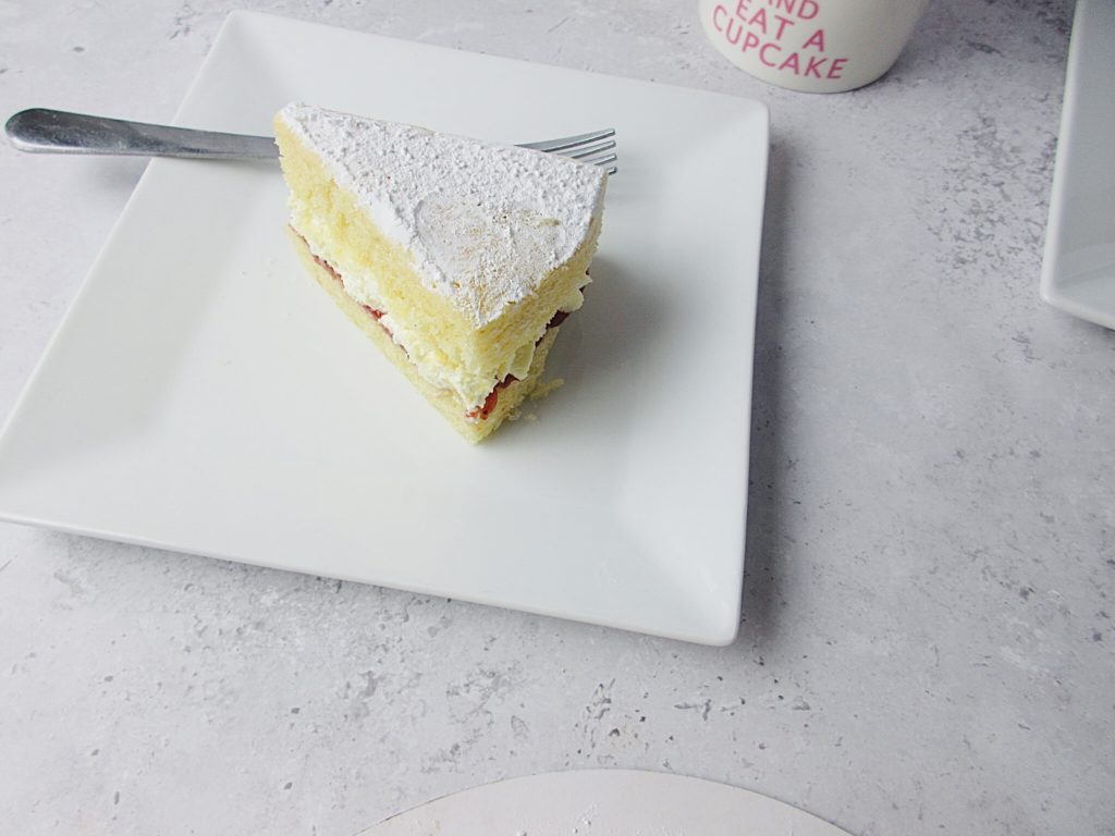 Slice of jam and cream sponge cake