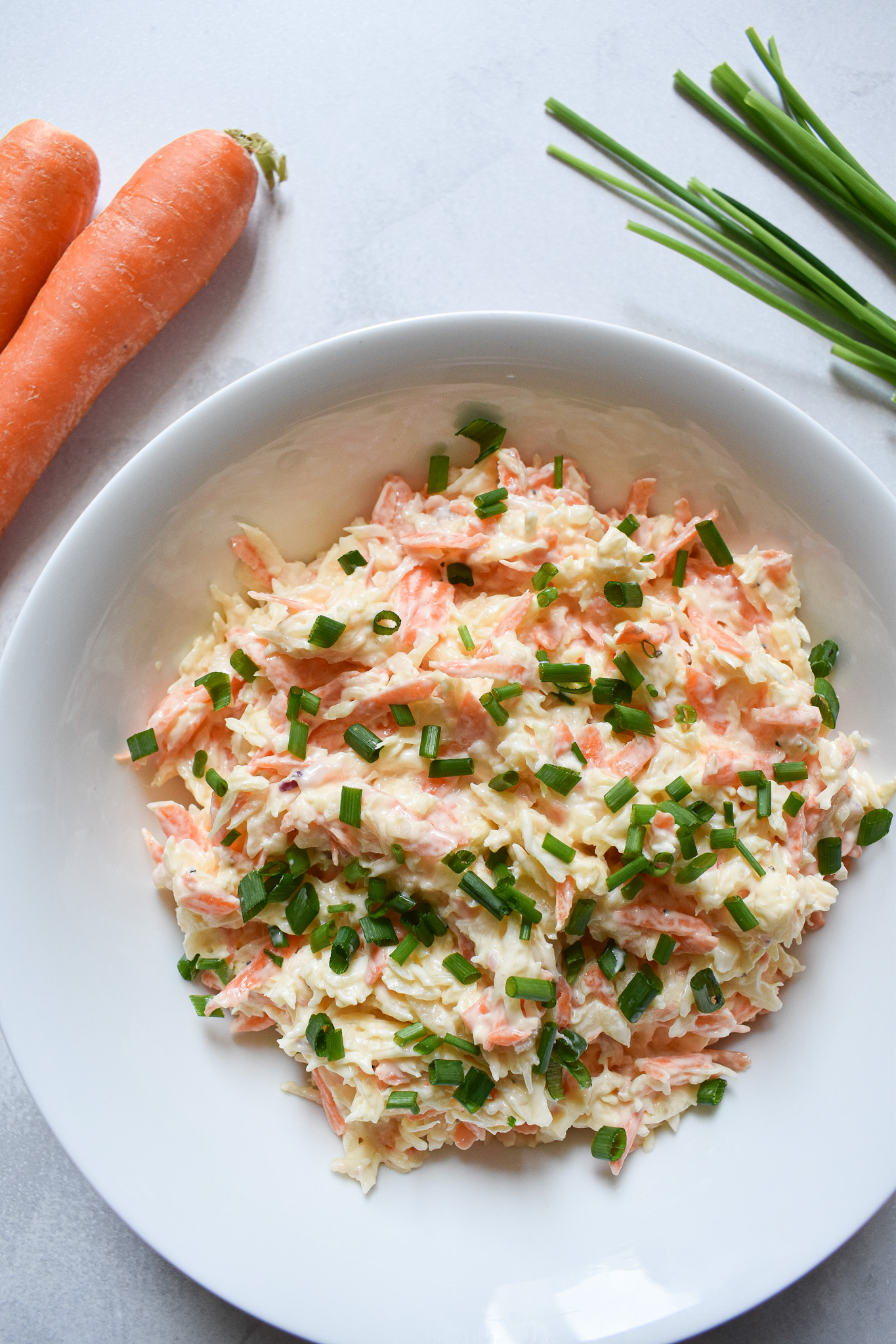 creamy reduced calorie coleslaw in white bowl