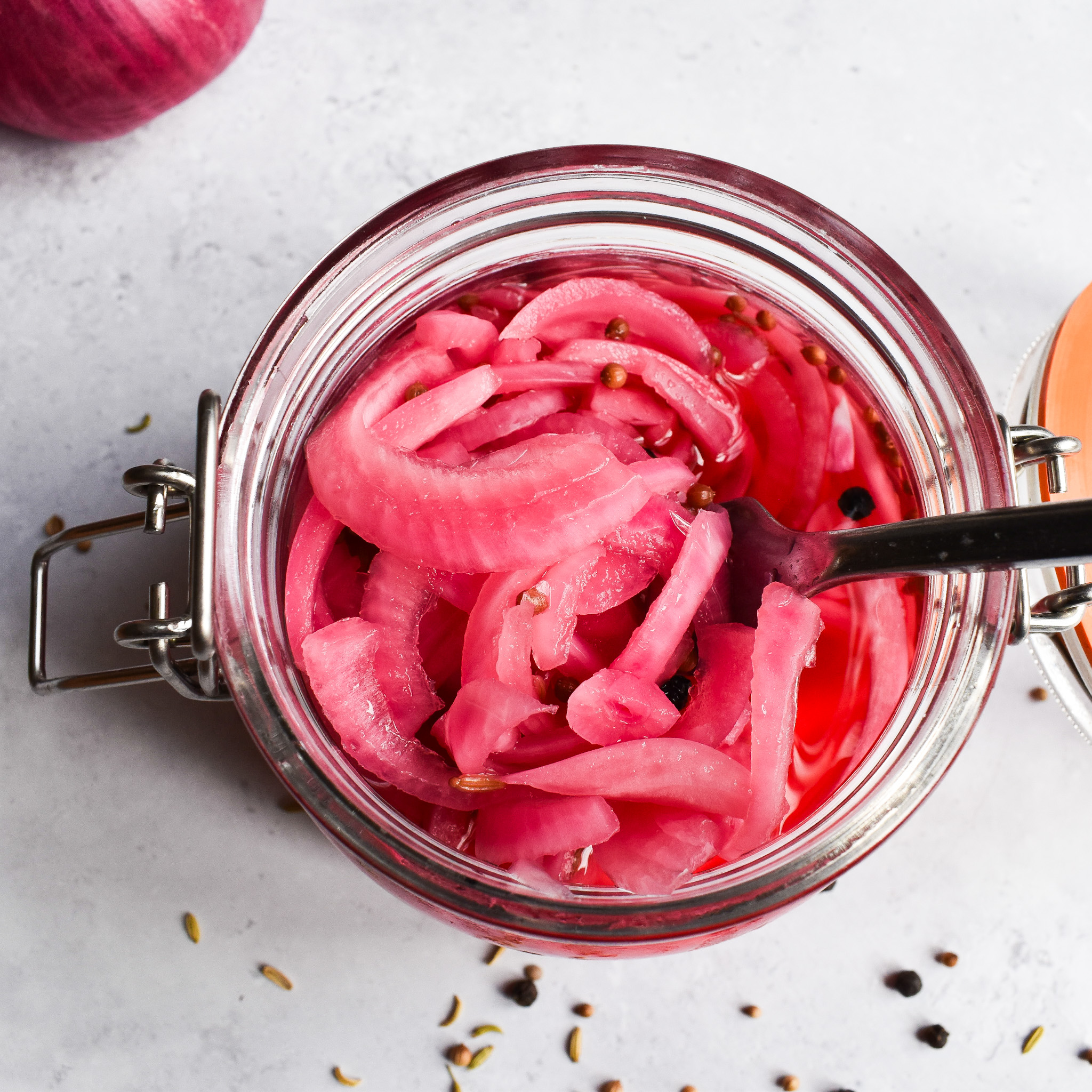 pickled red onions in a jar