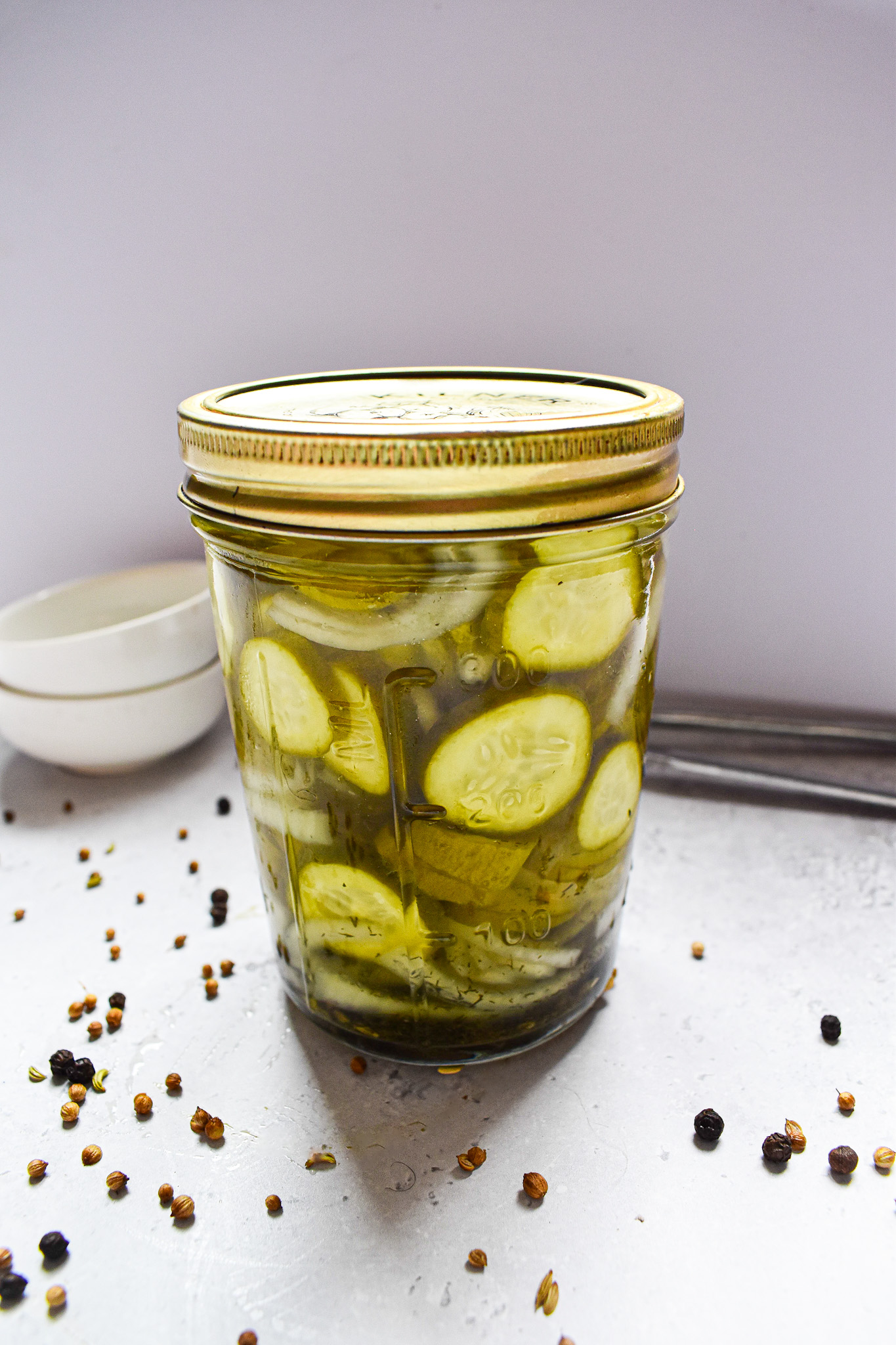 Pickled cucumber slices in a jar.