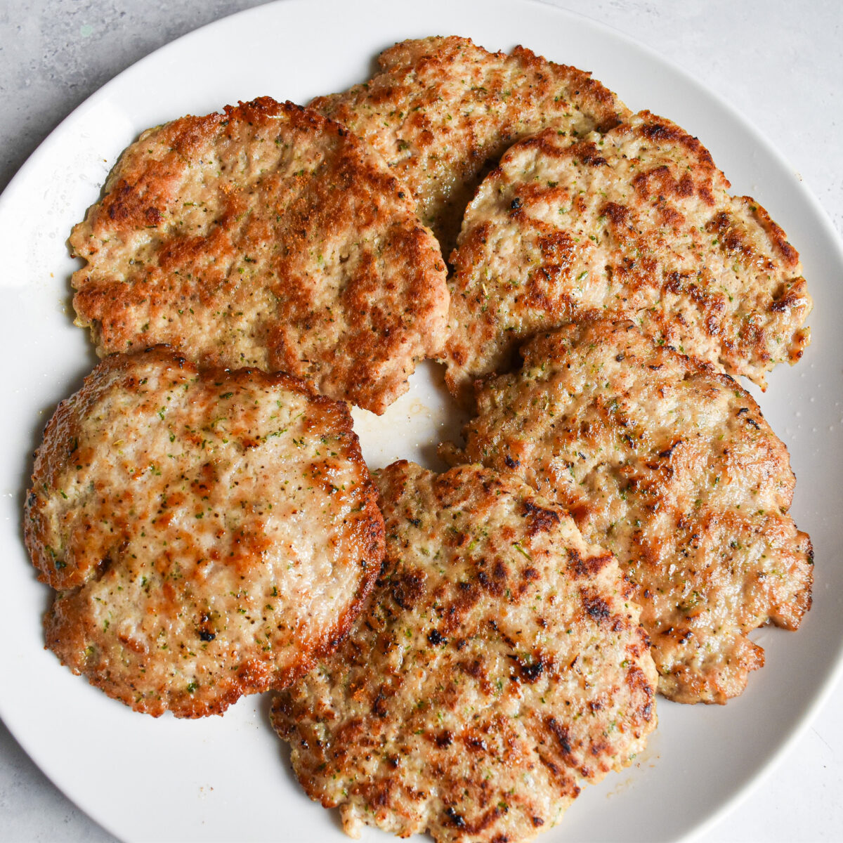 Breakfast sausage patties on a plate.